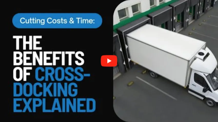 White delivery truck at warehouse cross-docking facility with video play button overlay