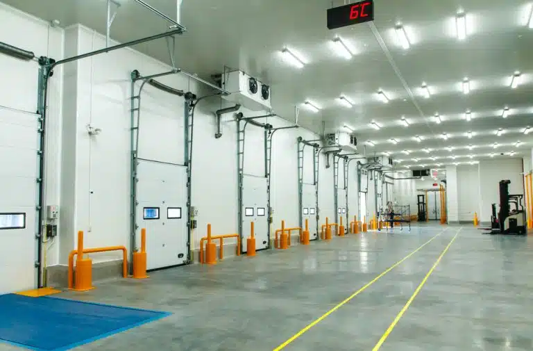Modern cold storage warehouse interior with loading docks and temperature control systems