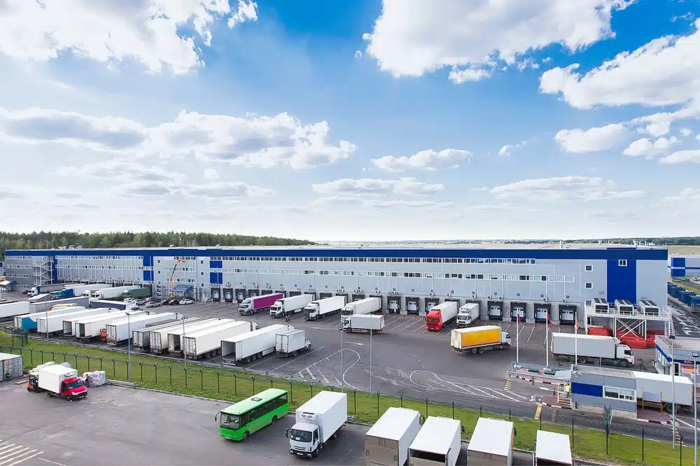 Modern distribution center with loading docks and trucks for efficient yard management