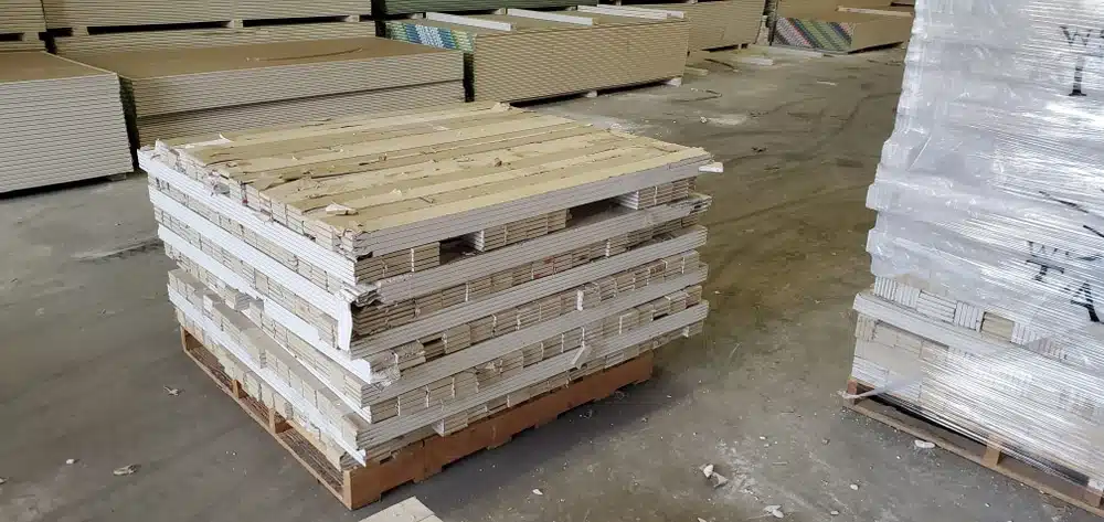 Warehouse floor with stacked pallets of packaged materials for shipping and receiving operations