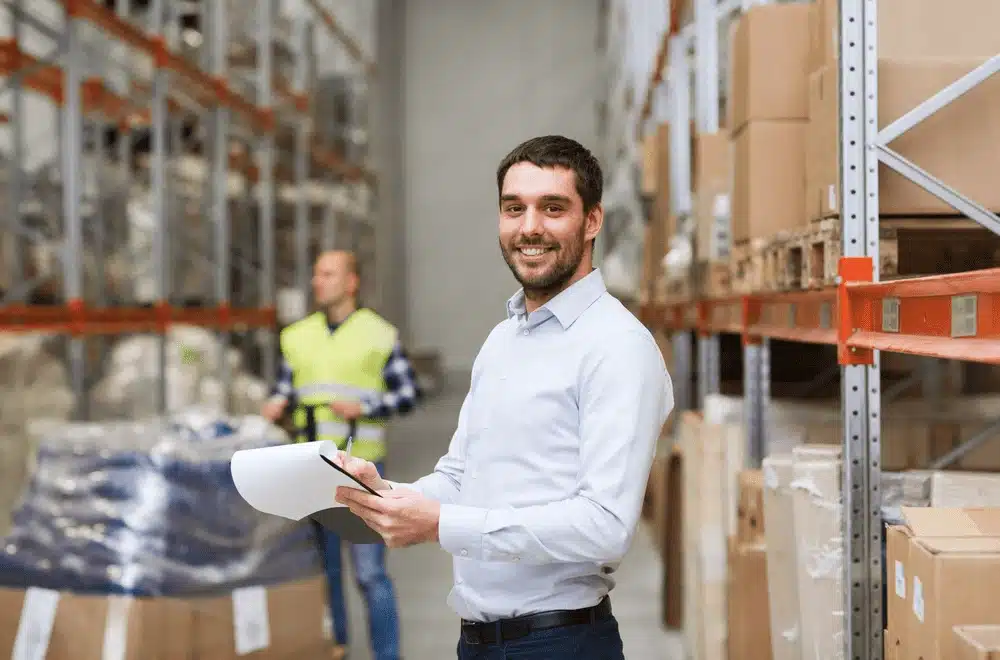 Warehouse manager with tablet overseeing 3PL logistics operations and inventory