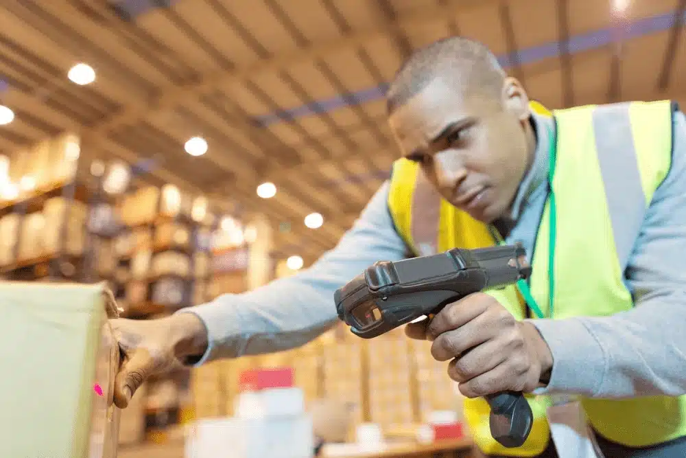 Modern warehouse facility with packaged products on conveyor system for efficient order picking