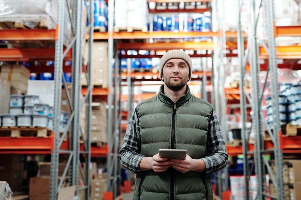 man standing in warehouse