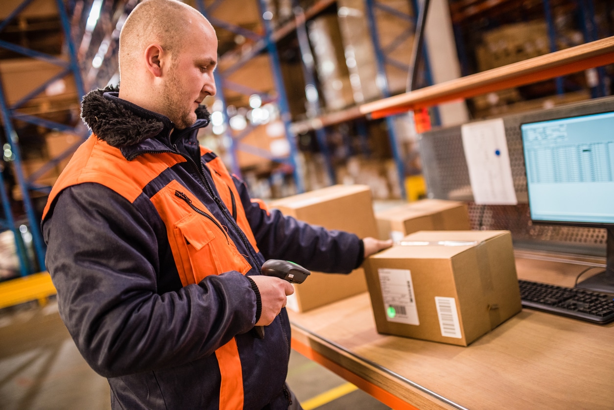 Worker scanning a return in warehouse