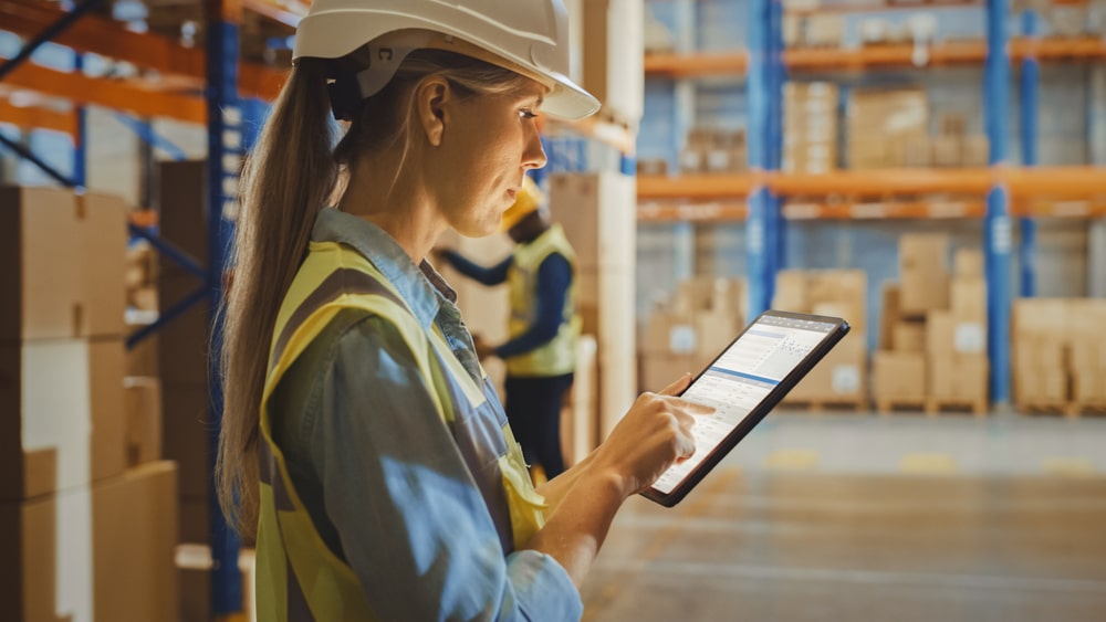 checking warehouse reporting on tablet