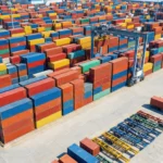 Colorful shipping containers and trailers organized in industrial yard facility